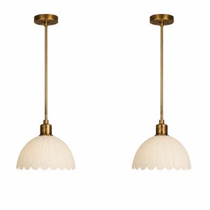 May include: Two identical pendant lights featuring a brass-toned metal rod and circular ceiling canopy. Each fixture has a semi-spherical, scalloped-edge glass shade in an opaque off-white finish, suspended by a matching brass-toned metal hardware.
