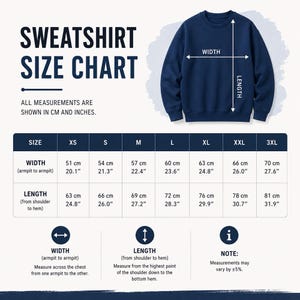 May include: A navy blue sweatshirt size chart displaying width and length measurements in both centimetres and inches for sizes XS through 3XL. The graphic includes a diagram of a sweatshirt with arrows indicating where to measure from armpit to armpit and from shoulder to hem, along with a note regarding a five per cent variance.