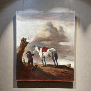 May include: An antique oil painting depicts a man with a horse and dog on a hillside under a cloudy sky. The horse is white with a red saddle. The man wears a hat and dark clothing. A dog sits near the man.