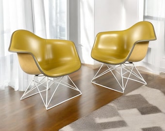 Pair of Eames for Herman Miller LAR Shell Chairs with Yellow Naugahyde Pads
