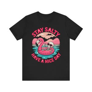 Beachy Skeleton Unisex Tee, Flamingo Float Graphic Shirt, Summer Vacation Top, Skeleton Beach Theme Apparel, Casual Skeleton T-Shirt