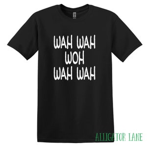 May include: Black t-shirt with white text that reads "WAH WAH WOH WAH WAH".
