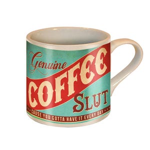 May include: White ceramic coffee mug with a teal background and a red stripe. The mug features the words "Genuine COFFEE SLUT" in a vintage font. The bottom of the mug reads "CAUSE YOU GOTTA HAVE IT EVERY DAY."