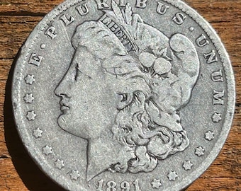 1891 O Morgan Silver Dollar In Good/Fine Condition. Classic Old Morgan And Good Stacker!