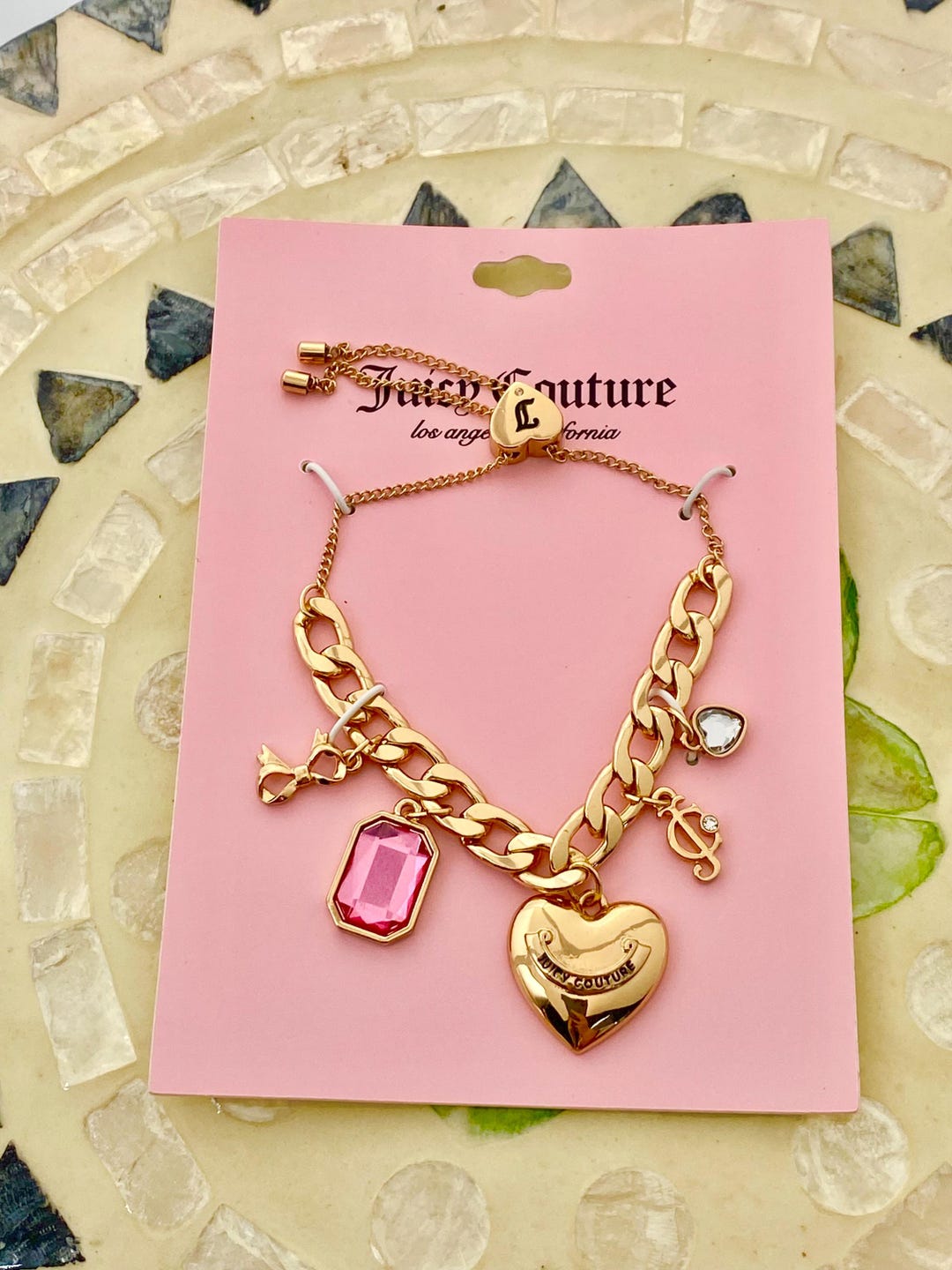 Juicy Couture Gold Plated Charm Bracelet With Pink Gem  display picture 2