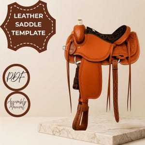 May include: A brown leather saddle template featuring a PDF and assembly manual. The saddle has a smooth tan seat, a dark brown padded section with decorative stitching, long leather straps, and a stirrup with detailed edge patterns.