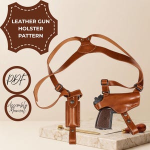 May include: A brown leather shoulder holster system with adjustable straps and a molded pouch for a firearm. The image includes text labels reading LEATHER GUN HOLSTER PATTERN, PDF, and Assembly Manual, along with a metal tool and a wooden awl.