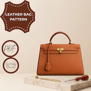 May include: A tan leather handbag with a gold-tone metal lock and handle, accompanied by a PDF assembly manual pattern. The image includes text reading LEATHER BAG PATTERN, PDF, and Assembly Manual, with a metal tool and awl on a marble base.