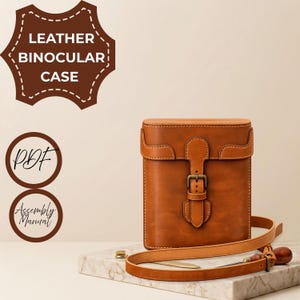 May include: A tan leather binocular case featuring a front flap with a buckle closure and an adjustable shoulder strap. The image includes text that reads LEATHER BINOCULAR CASE, PDF, and Assembly Manual in brown circular and shield-shaped icons.