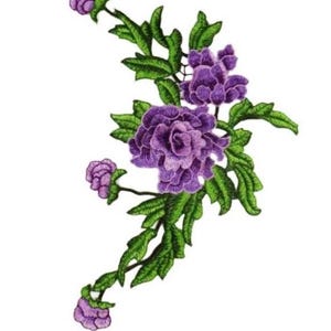 May include: Embroidered floral design featuring purple flowers and green leaves. The detailed embroidery showcases a cluster of large, fully bloomed flowers and smaller buds, with intricate leaf patterns. The design is set against a white background.