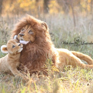 Big realistic lion and lion cub.