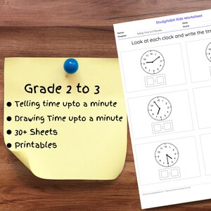 May include: A worksheet for grades 2 to 3 with clocks to write the time shown. The worksheet includes the text: Telling time upto a minute, Drawing Time upto a minute, 30+ Sheets, and Printables. A pencil rests on the worksheet.