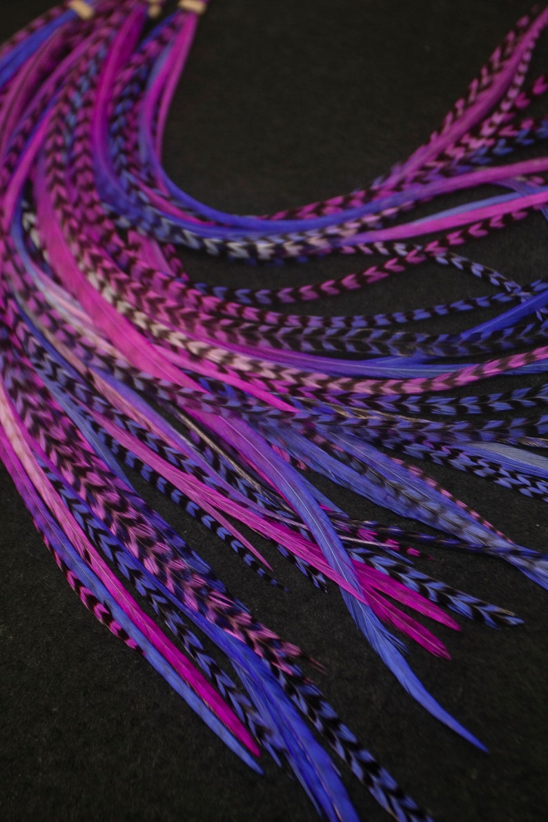vibrant purple and hot pink long feather hair extensions this is a pack of 10 do it yourself kit with 5 hair extension beads you will need pliers to install them. This pack is 8 to 11 inches for the feathers. A mix of grizzly & solid.