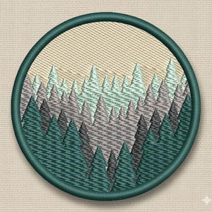 May include: Embroidered patch depicting a forest scene with layered evergreen trees in teal, grey, and light green. The circular patch has a teal border and a beige background, suitable for sewing or ironing onto fabric.