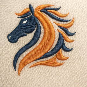 May include: Embroidered horse head design in navy blue and orange on a cream fabric. The horse's mane and facial features are intricately detailed, creating a striking visual effect. The design is likely for apparel or home decor.