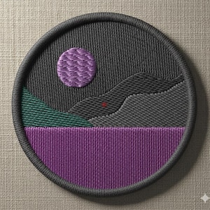 May include: Circular embroidered patch depicting a landscape. It features a purple sun, grey mountains, a green hill, and a purple lake. The patch has a grey border and is likely for clothing or accessories.