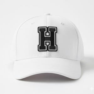 May include: White baseball cap with a black and white letter "H" patch. The letter is in a collegiate style with a black outline and a white border. The cap has a curved brim and a button on top.