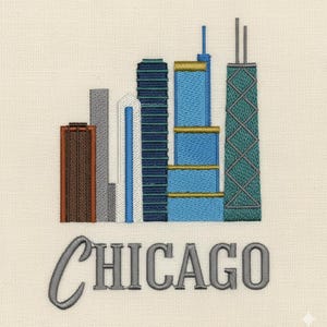 May include: Embroidered design of the Chicago skyline featuring several skyscrapers in shades of blue, brown, gray, and teal. The word "CHICAGO" is embroidered in gray script below the buildings. The design is on a cream-colored fabric.