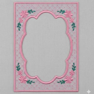 May include: Pink embroidered frame with a scalloped inner edge. The frame is decorated with pink flowers and green leaves at each corner. The background has a subtle floral pattern.