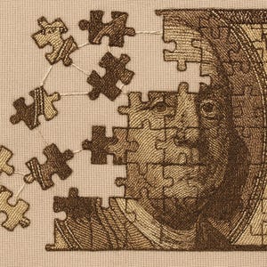 May include: An embroidered artwork featuring a deconstructed image of a $100 bill, with the portrait of Benjamin Franklin rendered as a jigsaw puzzle. Some puzzle pieces are detached, connected by threads, on a beige background.