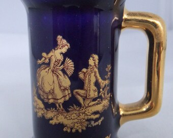 Vintage collectible Limoge miniature pitcher in cobal blue with gold detailing collectible
