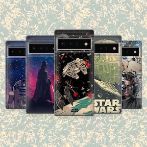 May include: A selection of phone cases with Star Wars imagery. The cases showcase designs of Darth Vader, the Millennium Falcon, R2-D2, and other characters and scenes from the Star Wars films. The cases have clear backs and black frames.