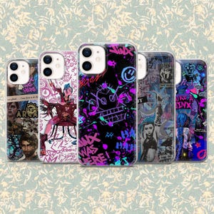 May include: Five smartphone cases with vibrant designs. The cases display character illustrations, graffiti, and text. The colour scheme includes pink, purple, blue, and black. The cases are for a mobile phone.