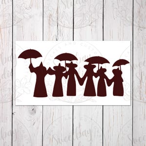 May include: A dark brown silhouette of five figures holding hands and umbrellas. The figures are wearing long robes and hats. The image is on a white background with the text "Decals and Custom Gifts" and "Sweetbay Studio".