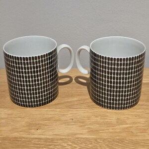 A pair of porcelain, onyx grey, coffee cups / cans made by Thomas of Germany.
