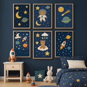 May include: Six framed art prints with a space theme. Each print features a dark blue background with illustrations of planets, stars, moons, and rockets. Some prints include a bear in a spacesuit or a bear on a cloud. The prints are in wooden frames.