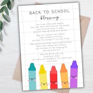 May include: A white rectangular card with a black grid pattern featuring the text BACK TO SCHOOL blessing followed by a poem. At the bottom, five colourful cartoon crayons in teal, yellow, red, orange, and purple each have a smiling face.