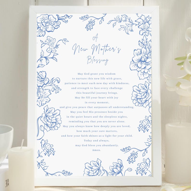 May include: A framed print featuring the text "A New Mother's Blessing" and blue floral designs. The print contains a poem, ideal for a nursery or as a gift to celebrate a new arrival.