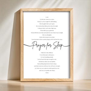 May include: A framed print with a light wood frame. The print features a poem titled "Prayer for Sleep" in elegant script, with the full text of the prayer below. The background is white with black text.