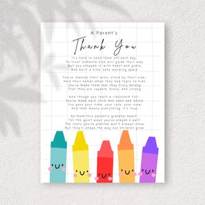 May include: A white print with the text "A Parent's Thank You" and a poem. The bottom of the print features five colourful crayons with smiling faces. The crayons are blue, yellow, red, orange, and purple.