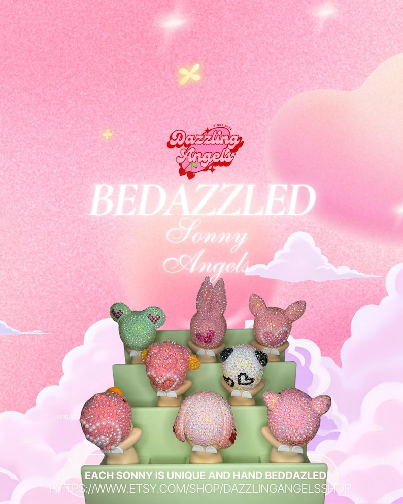 May include: A display of bedazzled Sonny Angels figurines. The figurines are in the shape of animals and are covered in sparkling rhinestones. The background is a soft pink with the text "Dazzling Angels" and "BEDAZZLED Sonny Angels".
