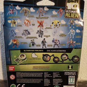 May include: A Ben 10 Ultimate Alien action figure package. The package features various action figures of different characters, with the words "Ultimate Alien" prominently displayed. The package also includes the Cartoon Network logo.