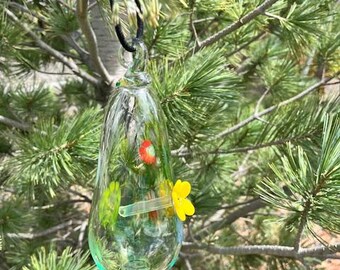 Handblown clear hummingbird feeder with flowers