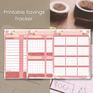 May include: Printable Savings Tracker in pink with floral accents. The tracker features sections for savings goals and progress, with a grid layout for tracking. The text "Printable Savings Tracker" is at the top.