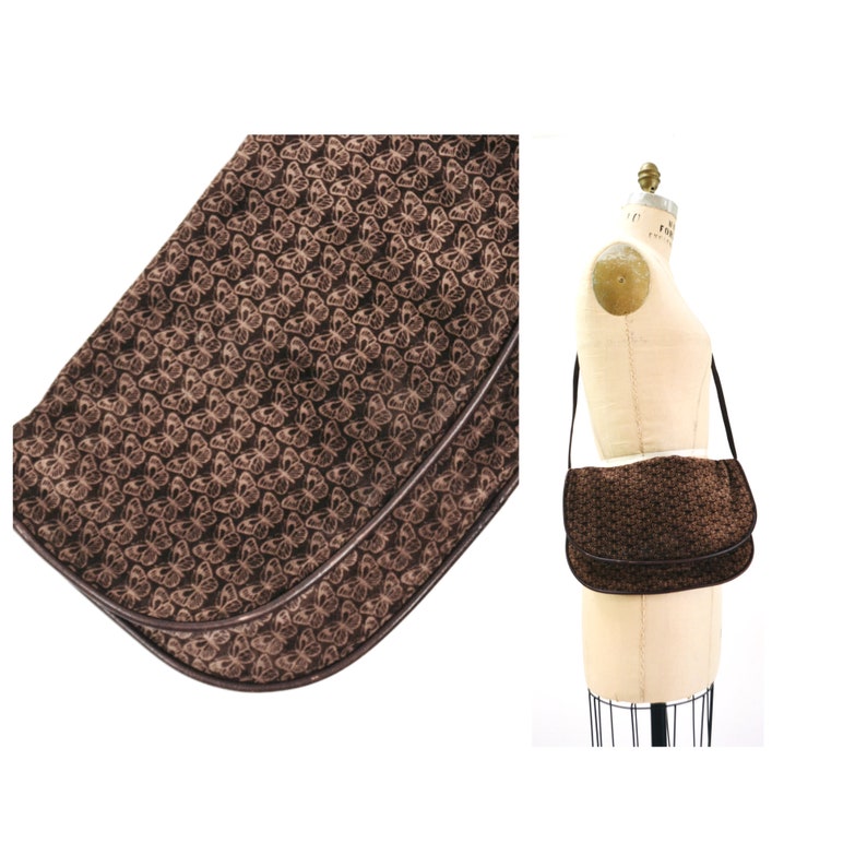 May include: A brown suede shoulder bag with a butterfly pattern. The bag has a flap closure and a brown leather strap.