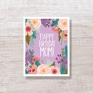 May include: A purple card with a floral border and the text "Happy Birthday Mom!" in white.