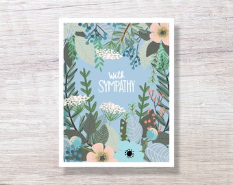 May include: A sympathy card with a floral design featuring blue, green, pink, and white flowers and leaves. The card has the text "With Sympathy" in the center.