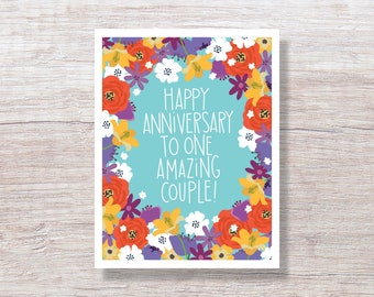 May include: A blue card with a floral border and the text "Happy Anniversary to one amazing couple!"