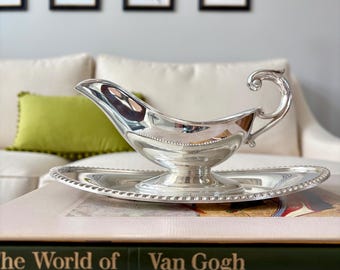 Vintage Crescent silverplate gravy boat with attached underplate: stamped on bottom.