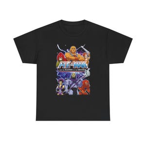 Puede incluir: Camiseta negra con un gráfico colorido de He-Man y otros personajes de la serie Masters of the Universe. El gráfico incluye el texto "HE-MAN" y "AND THE MASTERS OF THE UNIVERSE".