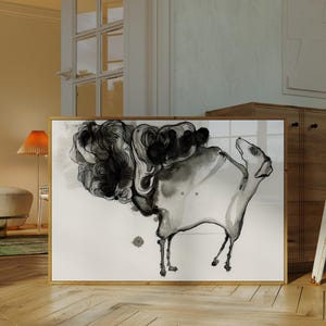 May include: A rectangular framed wall art piece featuring a black and white ink wash illustration of a stylized animal figure with a large, swirling cloud-like mass extending from its back, set against a plain white background within a wooden frame.