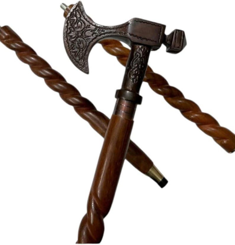 May include: A decorative walking cane with a dark brown, twisted wooden shaft. The top features a metal axe head with ornate detailing and a hammer. The cane is approximately 36 inches long.