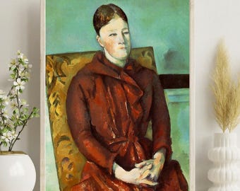Pode incluir: Retrato emoldurado de uma pessoa com um vestido vermelho sentada em uma cadeira estampada. A pintura tem um fundo turquesa. As mãos da pessoa estão entrelaçadas no colo. A obra de arte é exibida em uma prateleira branca.