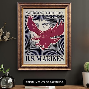 May include: Vintage framed print featuring a maroon eagle with outstretched wings, set against a blue and white background with radiating lines. The text reads "Semper Fidelis" and "U.S. Marines". The frame is a warm, golden brown.
