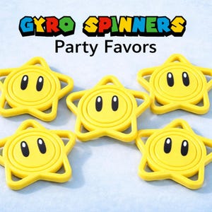 May include: Five yellow star-shaped gyro spinners with black eyes and a smiling face. The text "GYRO SPINNERS Party Favors" is displayed above the spinners in a colorful font. The spinners are on a light blue background.