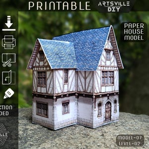 May include: A paper house model with a blue tiled roof and white walls with brown timber framing. The model has multiple windows and a front door. The image includes instructions for printing, cutting, folding, and sticking the model together.